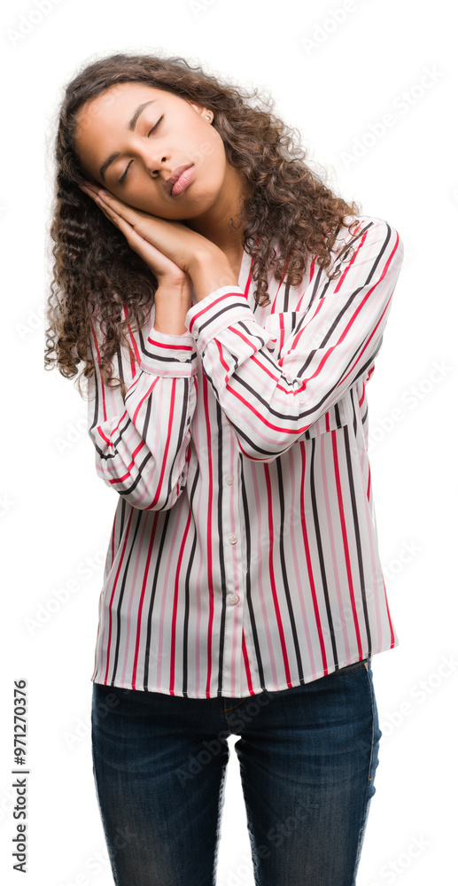 Wall mural Beautiful young hispanic woman sleeping tired dreaming and posing with hands together while smiling with closed eyes.