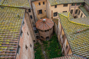  Aerial view of old octagonal building in the old town of Siena, Tuscany, Italy. Located near the...
