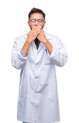 Adult hispanic scientist or doctor man wearing white coat over isolated background shocked covering...