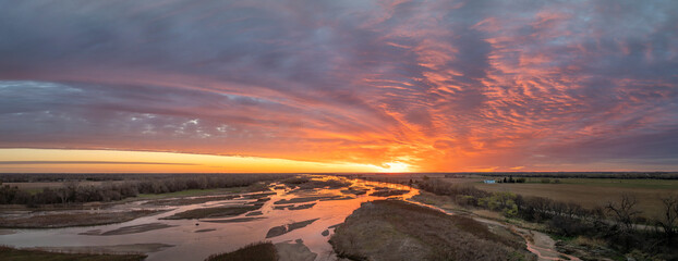 springtime sunrise over Platte River and plains near Kerney, Nebraska, aerial panorama