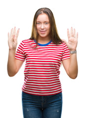 Young caucasian beautiful woman over isolated background showing and pointing up with fingers number nine while smiling confident and happy.