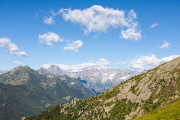 Fototapeta premium Panorama of Italian Alps with blue sky and cloud. Calm landscape, tranquil scenic view.