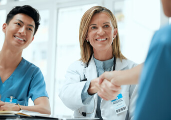 People, doctor and nurse with hand shake at boardroom for welcome and congratulations on...