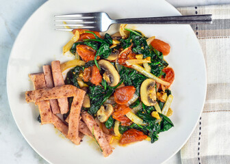 sauteed spinach   dish served with  spam fries