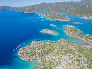Naklejka premium The ancient city of Simana, founded by the Lycian civilization, the sunken city of Kekova, rock tombs, castle, sea and nature reveal its magnificence.