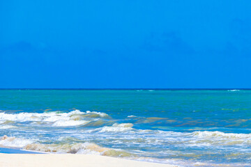 Tropical Caribbean beach clear water waves Playa del Carmen Mexico.