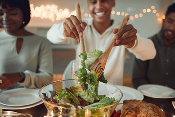 Dinner, salad and work event with office, food and social gathering at holiday celebration at...