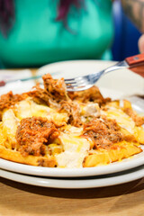 A plate of food with a fork in it