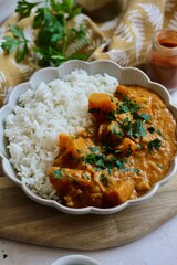 Tasty pumpkin and bean curry served with rice