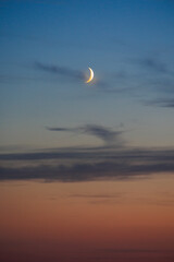 View of a waxing moon in the colourful evening sky from Friedberg towards Augsburg