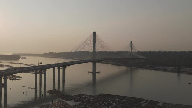 Drone footage of the Prayagraj bridge over Yamuna River at sunset time in India