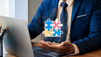 Businessman use laptop with jigsaw icon for solution and leadership strategies concept. Success in problem solving and visionary decision making