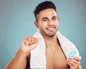 Studio, portrait and man with dental floss for oral, gum health and wellness with cleaning for...