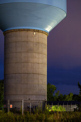 Lexington Park, MD USA  A blue-toppped water tower at night.