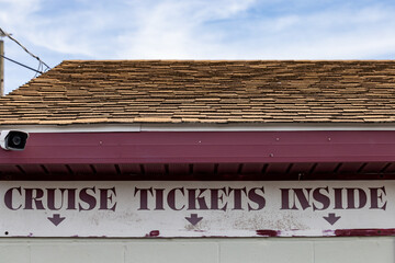 Crisfield, Maryland, USA A sign selling cruise tickets inside.