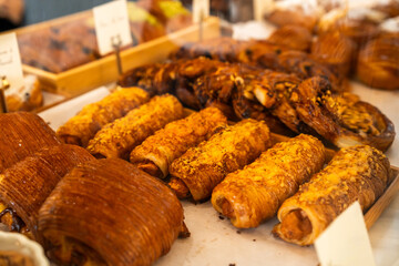 A Various type of bakery or croissant or Variety of golden brown, flaky croissants presented in a modern bakery showcase. Freshly baked and ready to sell. concept of coffee shop, coffee shop freshness