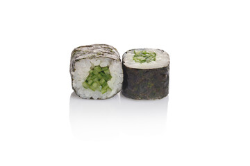 Fresh cucumber sushi rolls displayed on a clean surface with a glossy finish in a minimalist setting