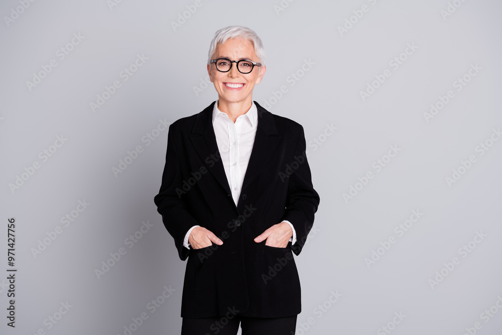 Poster Photo portrait of lovely pensioner lady startup boss hands pockets dressed formalwear specs isolated on gray color background