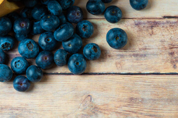 blueberries on wooden background
