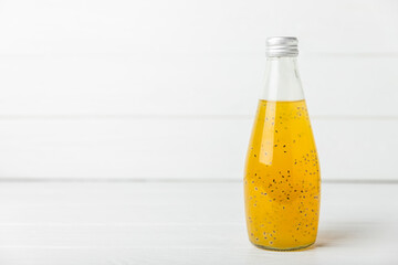 Diet detox cocktail with basil and chia seeds in a glass jar and a glass on a textured background. Drink with seeds. Health food. Detox cocktail. Antioxidant. Water with basil. Space for text.