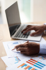 Fototapeta premium A businessman is analyzing his company's profits with a success graph that he has plotted.