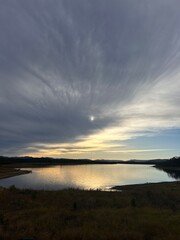 REFLECTING HORIZON SUNSET AT THE LAKE