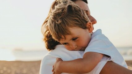 A child hugging parent on the beach