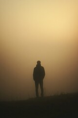 Fototapeta premium Person Standing in Fog