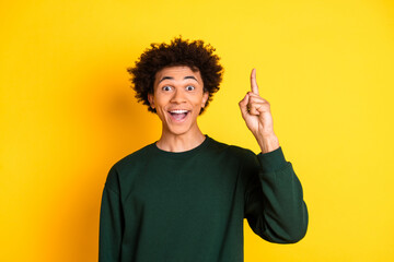 Photo of nice young man point finger wear pullover isolated on yellow color background