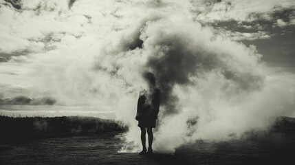 A Silhouette of a Person Standing in Dense Fog