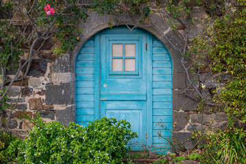 small blue door in the former abbey of Landévennec, Brittany