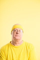 Retro, gym and portrait of man with headband, serious and exercise workout in studio mockup. Pride, face and mature person with vintage style, fitness fashion or confidence on yellow background space