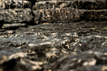 Close up of abstract black marbled rock surface