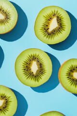 Fototapeta premium Cut Kiwi Fruits on Blue Surface