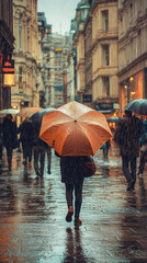 A person huddled under large umbrella on busy street in rain