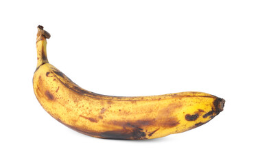 Overripe banana with dark spots isolated on white
