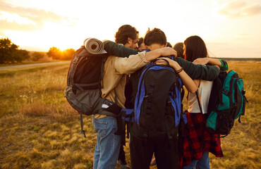 Team of friends captures a heartwarming moment during nature hiking travel at vacation. They form a tight circle, embracing each other with togetherness, camaraderie and joy of shared adventures