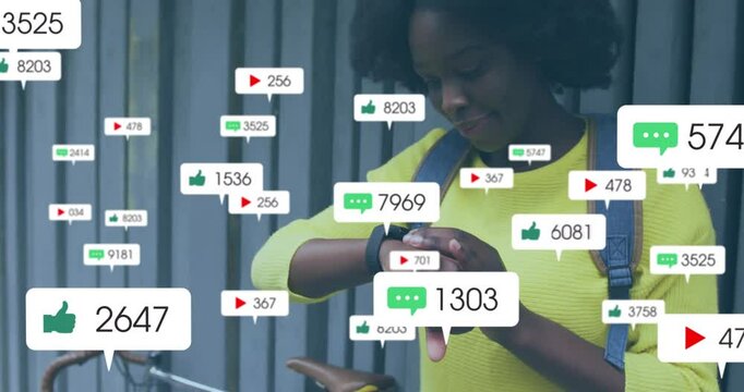Animation of media icons over african american woman using smartwatch