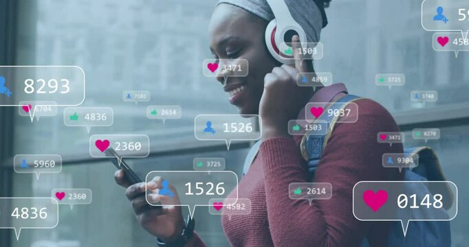 Animation of media icons over african american woman listening to music