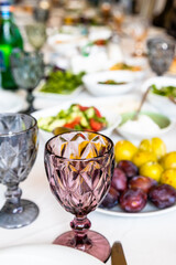 empty faceted wine glass on served table