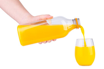 Glass of Orange juice. Organic orange or lemon drink in plastic bottle. One gallon of cold juice. Fresh fruit juice for drinking cocktail. Vitamin citrus tropical lemonade. Hand pouring juice in glass
