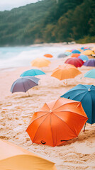 Colorful umbrellas scattered on sandy beach create vibrant scene