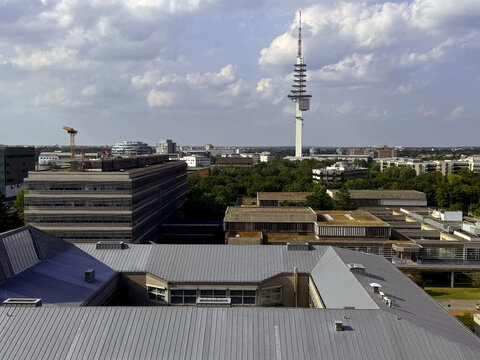 Panoramic view over the state capital of Lower Saxony in Germany. The districts of Buchholz and Bothfeld, with the television tower and the city's hospitals in the middle.  A sunny day with a clouds.