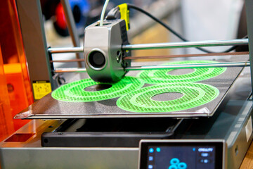 The process of printing on 3D printer. 3D printer creating model from molten plastic close-up. Molten plastic flowing of extruder and forming three-dimensional volumetric object. Additive technologies