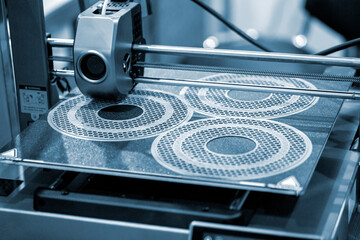 The process of printing on 3D printer. 3D printer creating model from molten plastic close-up. Molten plastic flowing of extruder and forming three-dimensional volumetric object. Additive technologies