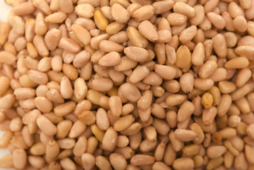Pine nuts in close-up. Hazelnuts.