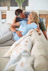 Obraz premium We adore each other. Shot of a loving mature couple relaxing at home.