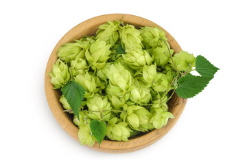 Hop cones in wooden bowl isolated on white background. Beer brewing ingredients. Top view. Flat lay