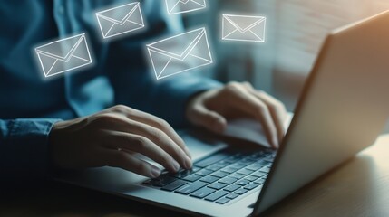 Person using Laptop with Email Icons