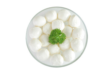 Mini mozzarella balls with parsley in a glass bowl isolated on white background. Top view. Flat lay.